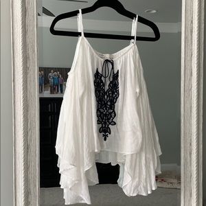 White open shoulder top w/ navy design
